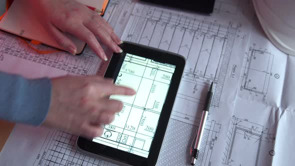 Close-up Of Hands Architect Woman Using Tablet Pc with Stylus