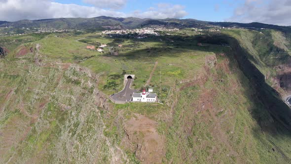 Flying over Ponta do Pargo lighthouse, built on a cliff, Madeira, Portugal alt