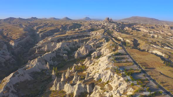 Cappadocia Aerial Drone View Sandy Volcanic Formations and the Road Leading To the Uchisar Castle alt