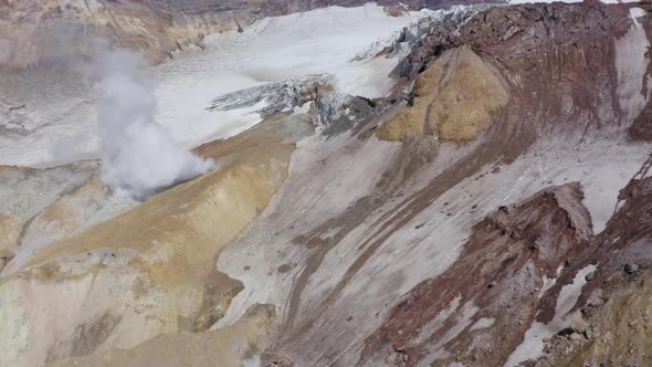 Aerial Drone Footage of Mutnovsky Volcano Crater with Fumaroles and Glacier