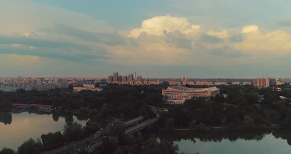 Aerial shot above Bucharest. View above Tineretului park, evening shot alt
