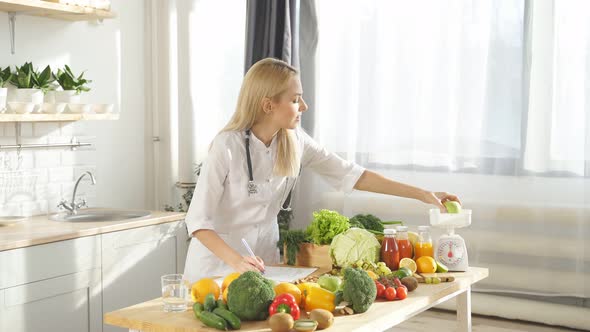 Cute Dietitian Blogger Writes Video Content About Healthy Food and Healthy Eating on Her Smartphone alt