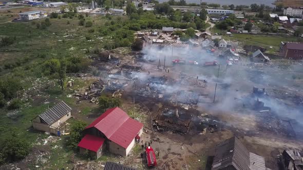 People Are Extinguishing Fire, Pouring Water on Smouldering Ruins, Aerial View