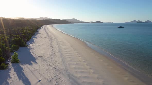 Whitehaven Beach Whitsundays vertical aerial with white sand and lens flare, Queensland alt