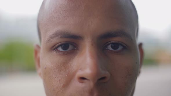 Closeup Shot of African American Man Looking at Camera alt