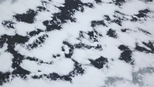Aerial Drone View Looking Down On Frozen Ice Lake In Winter 1
