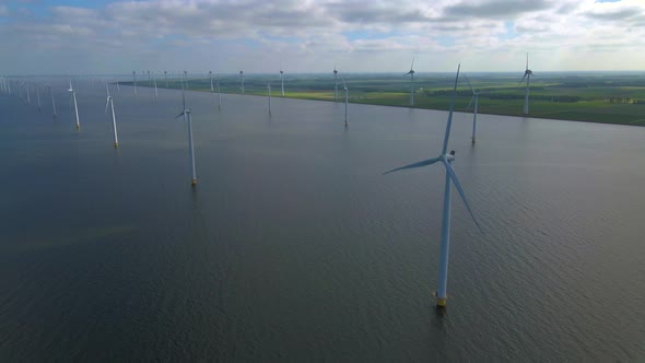 Wind Turbines in the Early Morning Wind Mill Park in the Netherlands alt