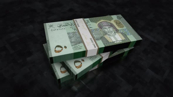 Oman Rial money banknote pile packs alt