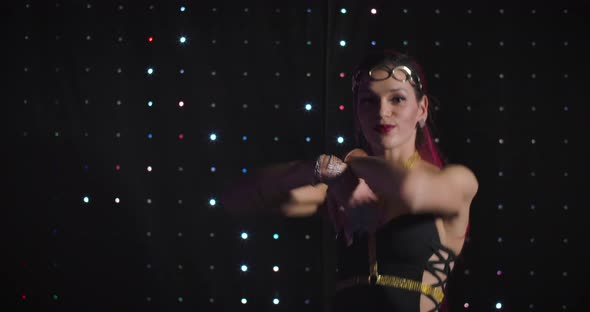 Portrait of Professional Female Go Go Dancer with Tattoo on Hand and Red Hair Dancing alt