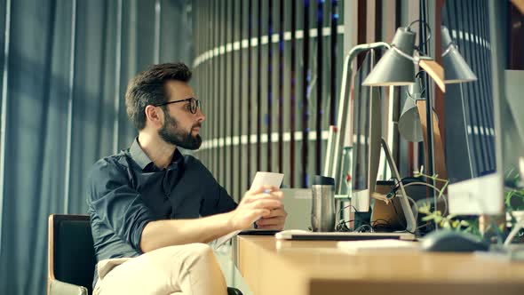 Accountant Calculate Profit. Bookkeeper Auditing Paperwork In Office Workplace. Overtime Work. alt