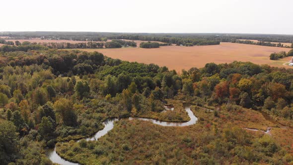 Beautiful countryside with a small river and autumn trees, Aerial landscape