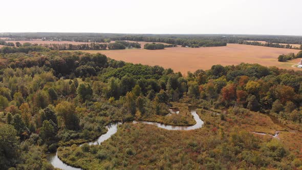 Beautiful countryside with a small river and autumn trees, Aerial landscape