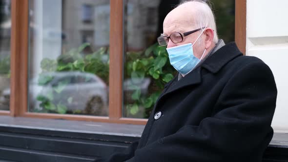 The Old Grandfather Coughed a Lot While Sitting on the Bench He Got the Flu alt