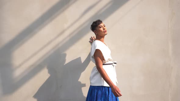 4K Confidence Asian lgbtq guy wearing woman clothes walking down city street. alt