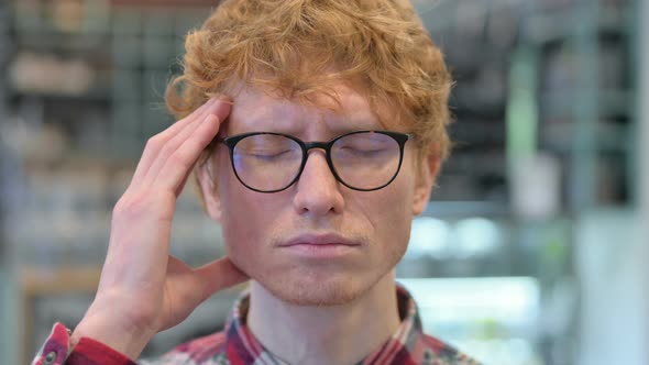 Close Up of Stressed Young Redhead Man Having Headache alt
