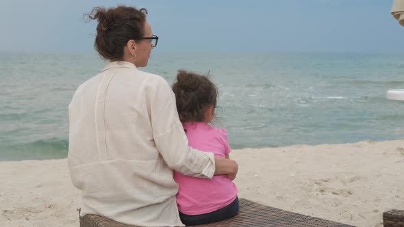 Family on the seashore. alt