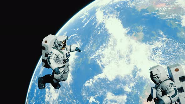 Astronaut in Outer Space Over the Planet Earth