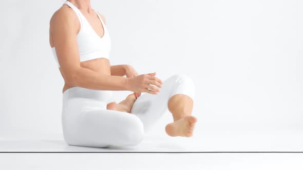 Senior Woman in White Space Practice Yoga alt