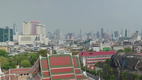 4K Urban landscape shot of a panoramic view of Bangkok, Thailand on a sunny day, from the top of the alt