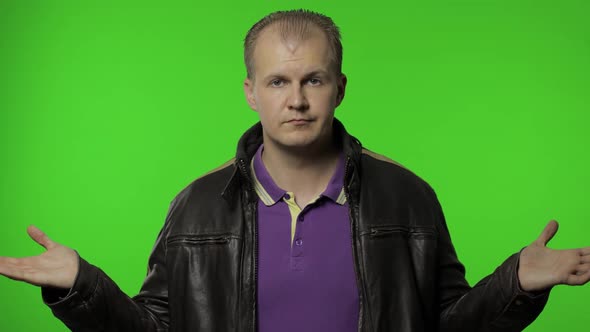 Confused Rocker Man Looking Around, Making Choice, Difficult Decision. Guy Biker on Chroma Key alt