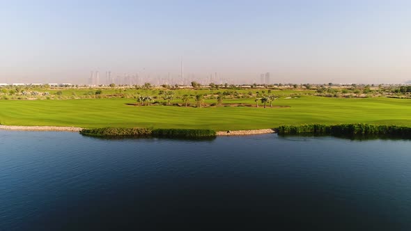 Aerial view of artificial pond in luxury golf club, Dubai, U.A.E. alt