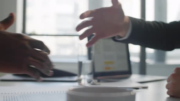 Close Up of Handshake of Two Multiethnic Businessmen alt