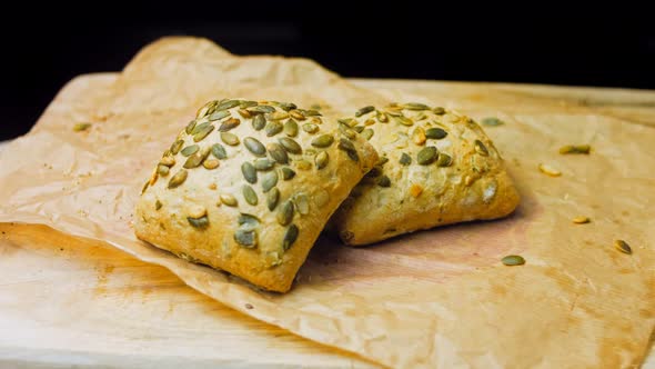 Two Freshly Baked Square Loaves of Bread with Pumpkin Seeds alt