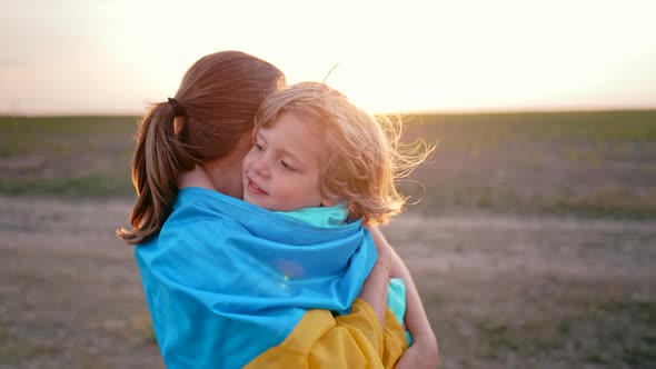 Ukrainian Family  Loving Smiling Son Hugs Mom Tightly alt