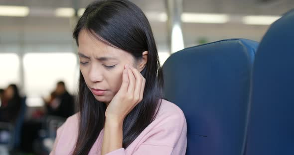 Woman feeling headache on ferry