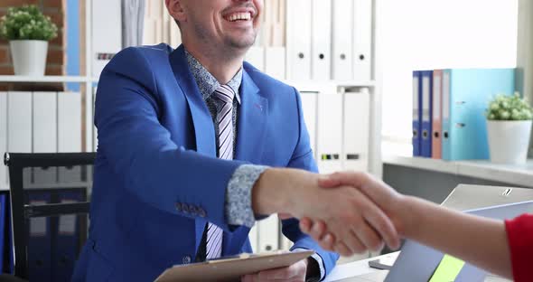 Businessman Shaking Hand with Woman Partner in Office  Movie Slow Motion alt
