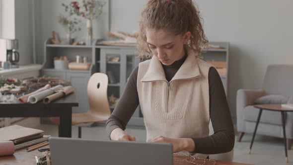 Woman Decorating Christmas Gift Boxes alt