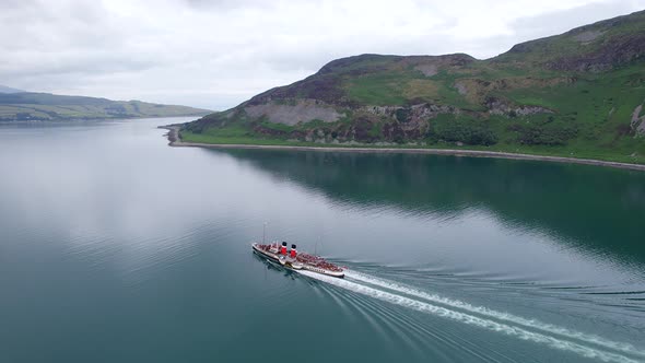 A Paddle Steamer Taking Tourists on a Sea Tour alt