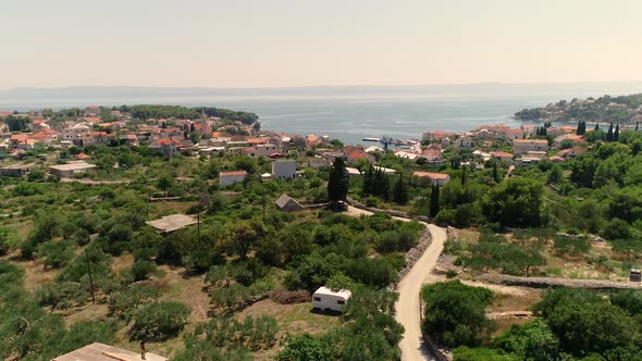 Aerial view of countryside road leading towards Sumartin, Brac island, Croatia. alt