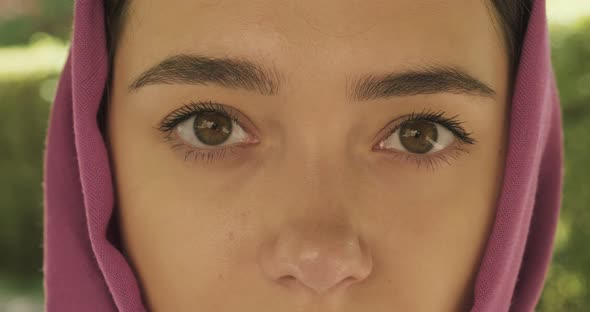 Beautiful Young Woman Looking at Camera, Wearing Traditional Headscarf. Attractive Female in Hijab alt