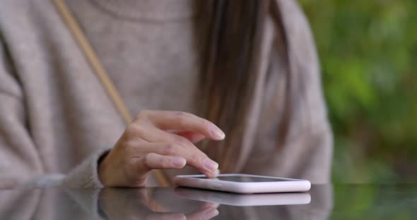 Close up of woman use of mobile phone at outdoor alt