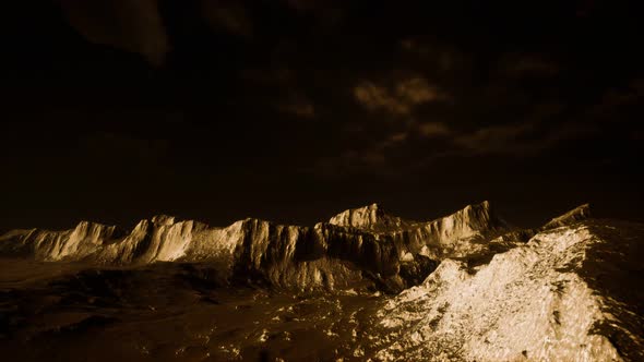 Dark Clouds Over Volcanic Valley with Grass and Rocks alt