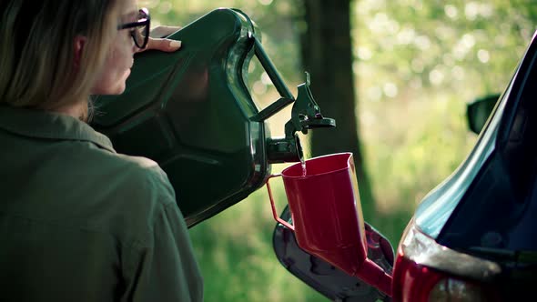 Filling Bio Diesel Into Gas Tank Canister. Refilling Gasoline Fuel Tank Car. Petrol Crisis Price. alt