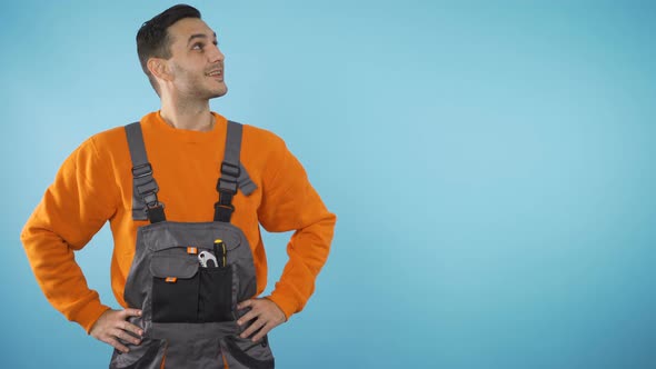 Smiling Construction Worker Looking To the Side, Presenting Invisible Product, Copyspace alt