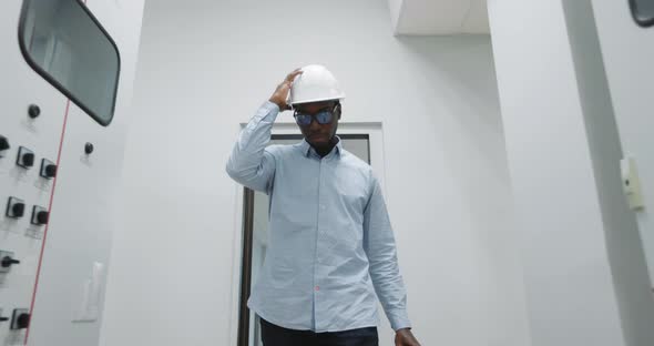 An Engineer Puts on a Helmet alt