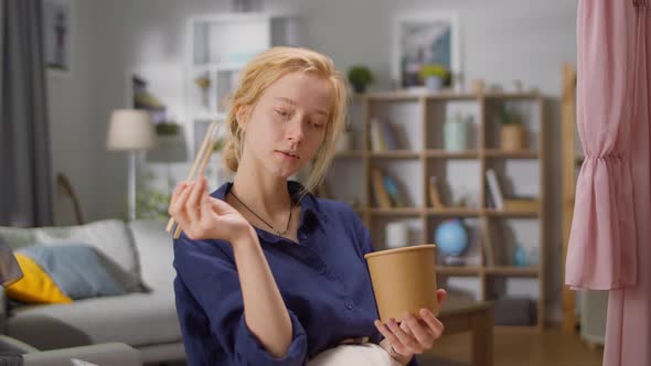Dressmaker Woman Having Lunch During a Break at Home Tailoring alt