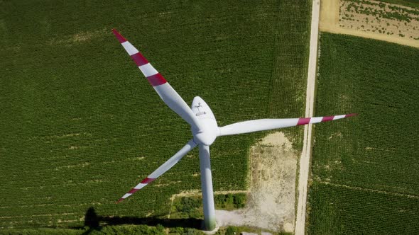 Aerial flight wind turbines. Clear renewable energy production. Farm landscape. Drone flight