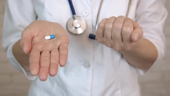 Doctor Choose Pills in Hands Indoor alt