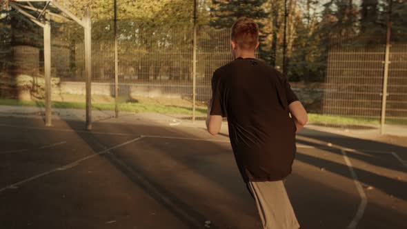 The Guy on the Ice Court Hits the Ball in the Ring alt