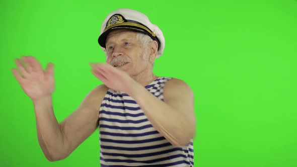 Elderly Sailor Man Funny Dances. Old Sailorman on Chroma Key Background alt