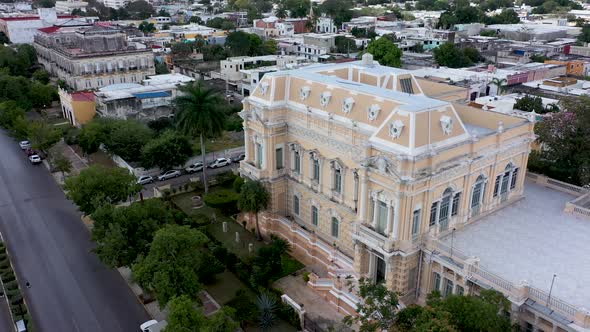 Aerial orbit to the left of the Palacio Canton museum mansion on the Paseo de Montejo in Merida, Yuc alt
