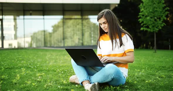 Woman with Laptop Working Outdoors