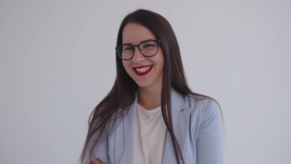 A Beautiful Young Business Lady is Fooling Around and Showing Her Tongue Laughing alt