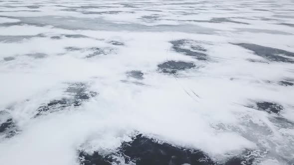 Aerial Drone View Flying High Above Frozen Ice Lake In Winter 3