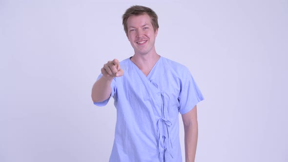 Portrait of Happy Young Man Patient Pointing at Camera alt