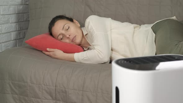 Tranquil Woman By Humidifier alt